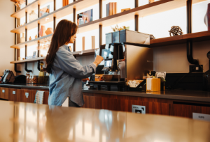 Woman making a coffee